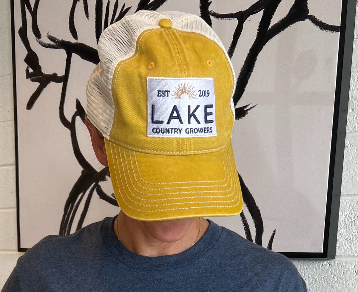 Lake Country Growers mustard yellow snap back hat